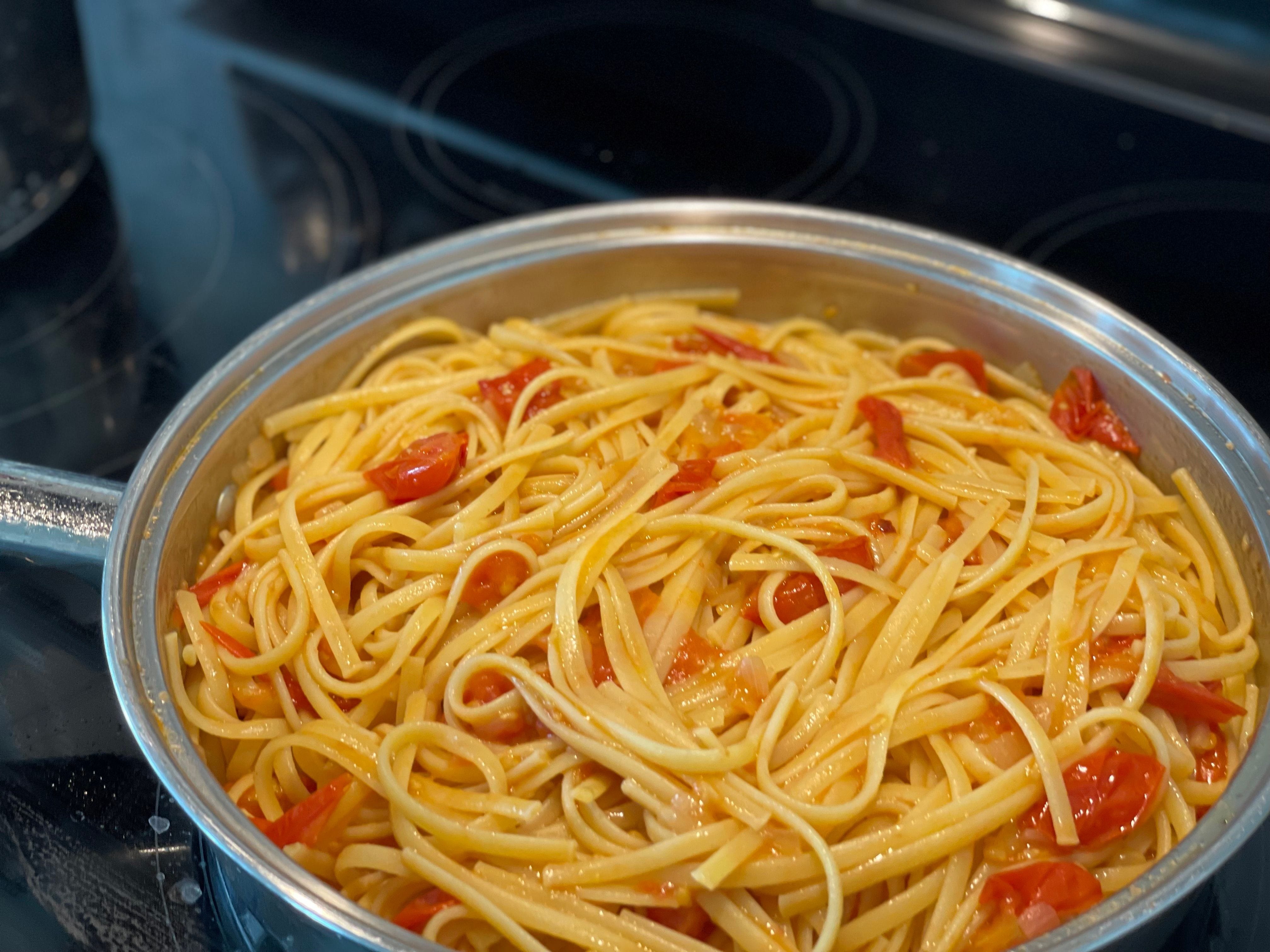 Pasta tossed with fresh tomato sauce.