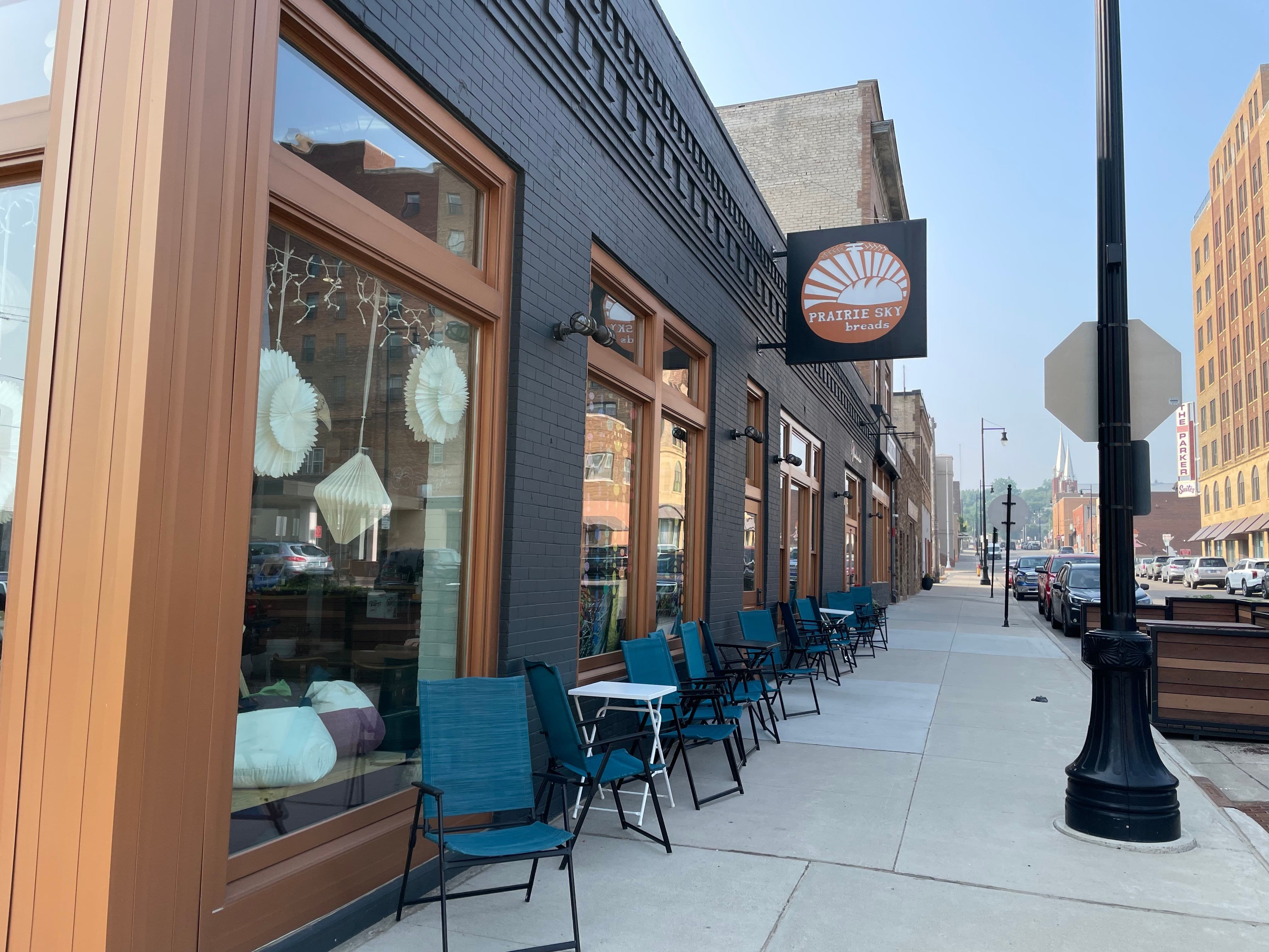 A picture of Prairie Sky Breads offers a glimpse of the parklet at 1st and Central. 