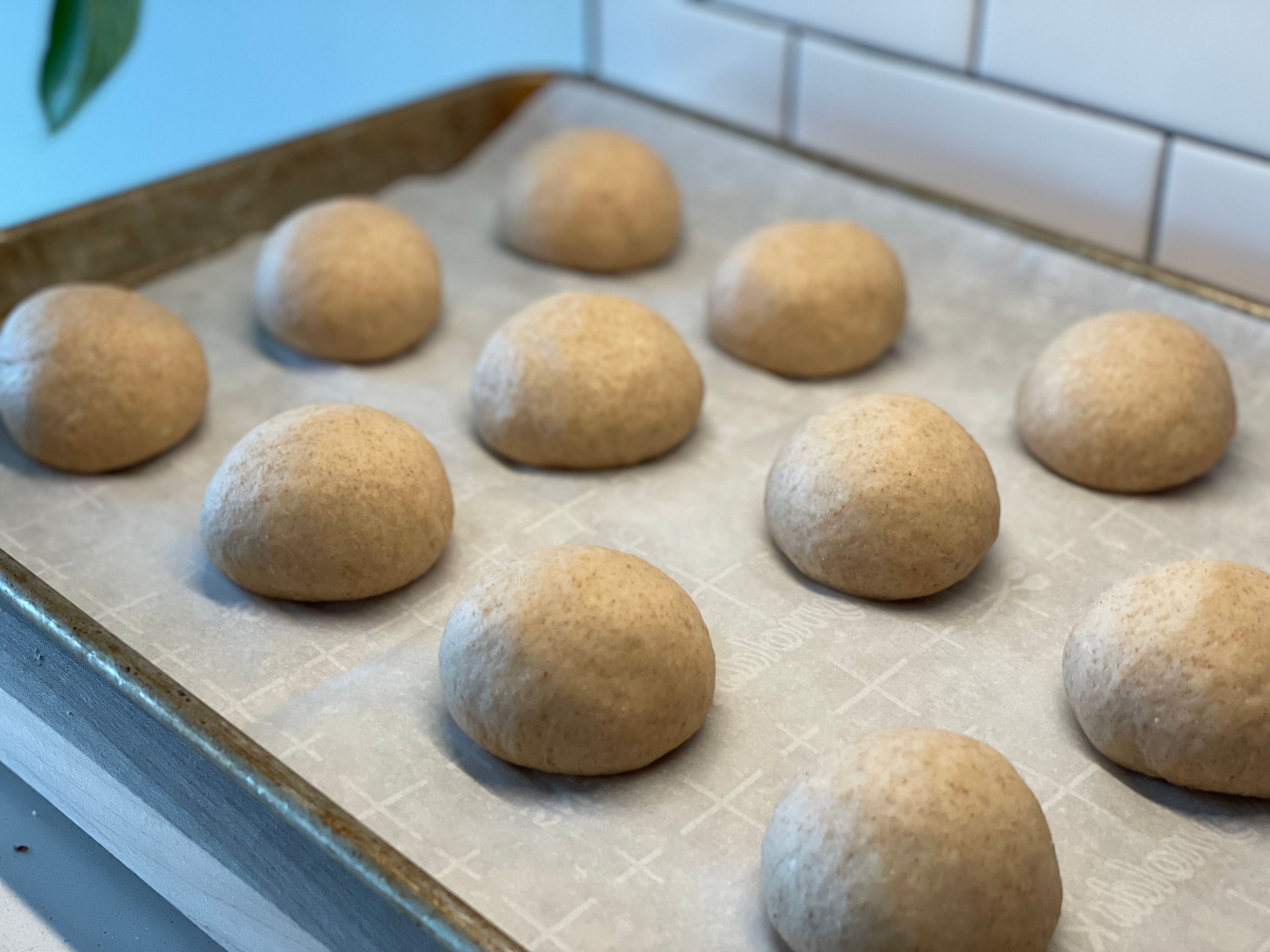 The 12 dough balls rest for 30 minutes before rolling.